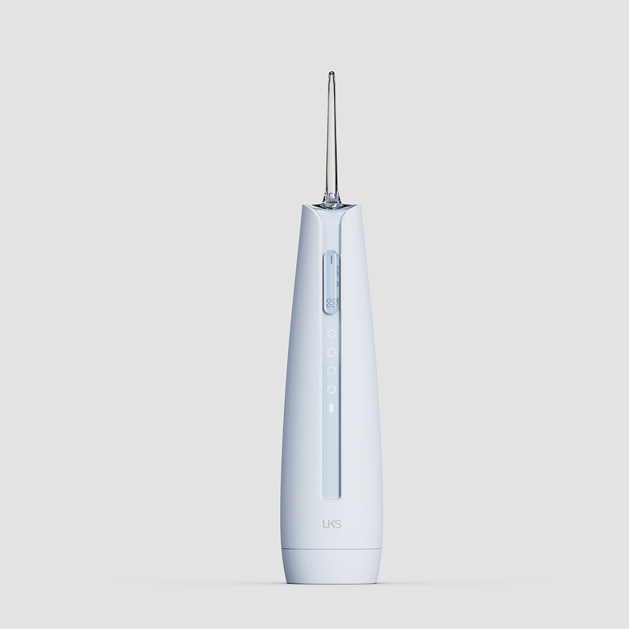 white dental water flosser on a light gray background