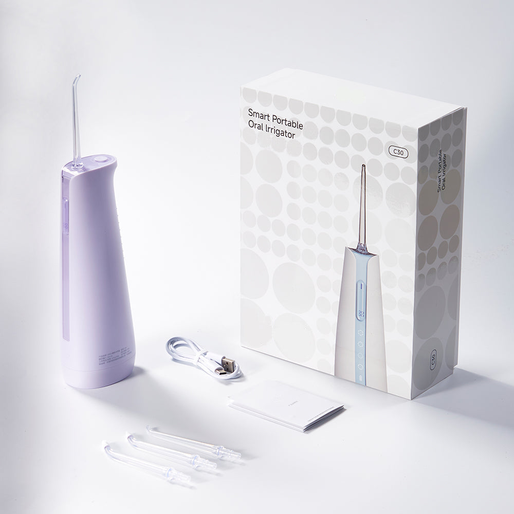 smart portable oral irrigator with packaging on a white background