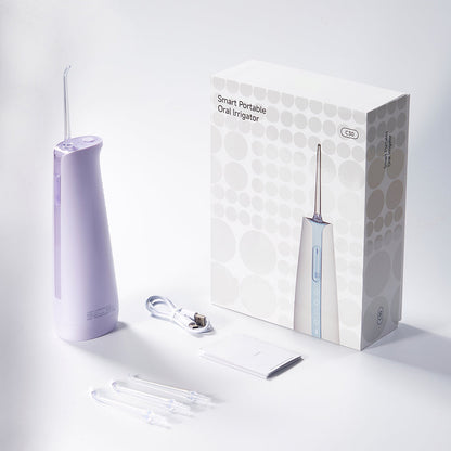 smart portable oral irrigator with packaging on a white background