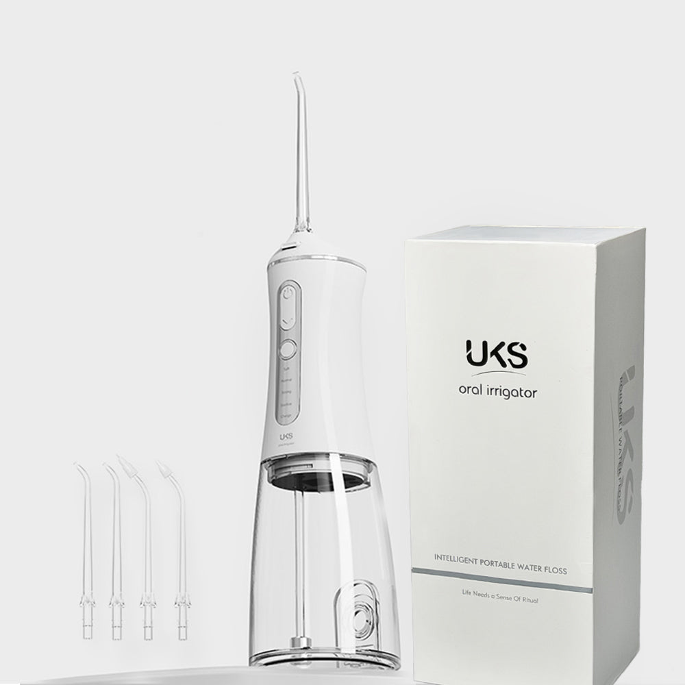 oral irrigator with packaging on a white background
