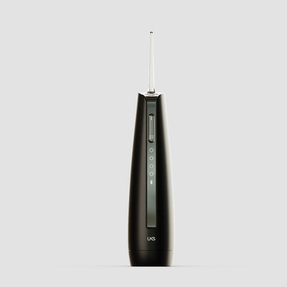 Black dental tool with visible brand logo on a light gray background