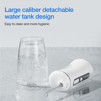 Clear detachable water tank and white device on a light gray background with text about hygiene.
