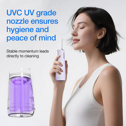 Woman holding a dental water flosser with UVC UV grade nozzle, text about hygiene and peace of mind.
