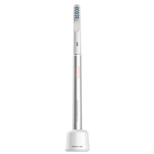 Electric toothbrush with a white handle and bristle head on a white background
