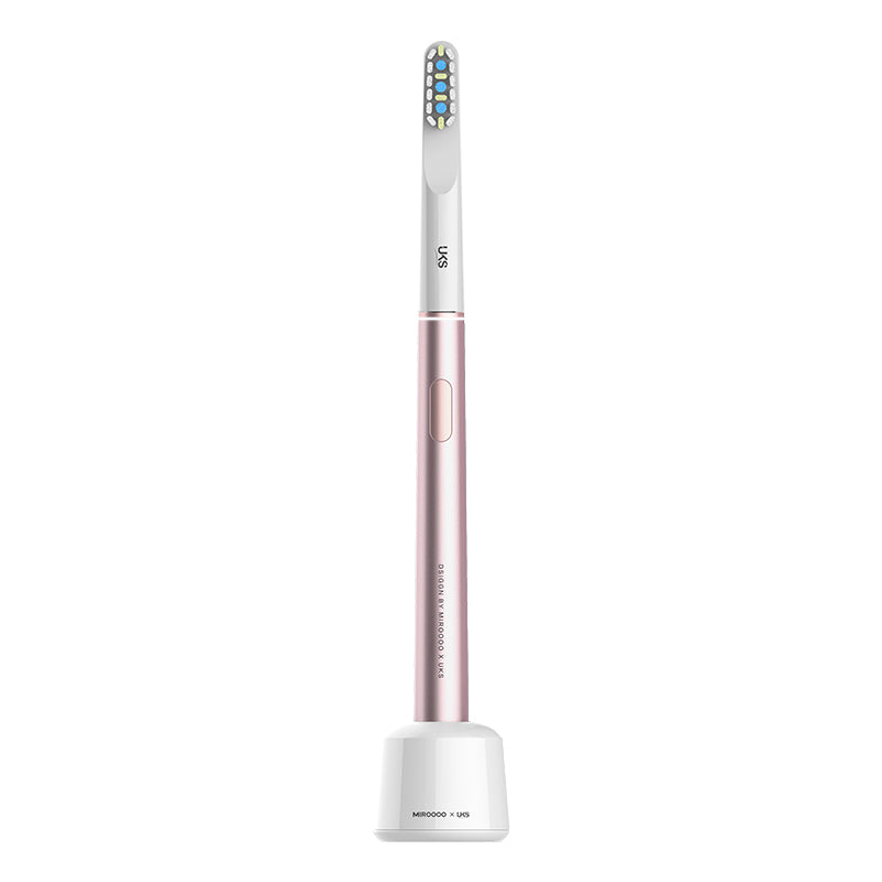 electric toothbrush with a rose gold handle and white bristle head on a white background
