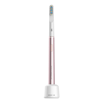 Electric toothbrush with a rose gold handle and white bristle head on a white background